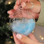 Personalised Silver Name & Footprints Motif Blue Feather Glass Christmas Bauble - Image 2