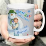 Personalised The Snowman and the Snowdog 'Merry Christmas' Blue Ceramic Mug - Image 2