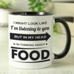Personalised 'I Might Look Like I'm Listening' Black Handled Ceramic Mug