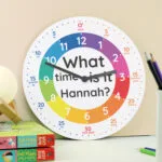 Personalised Children's 'What Time Is It?' Round Wooden Wall Clock