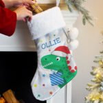Personalised Dinosaur Design Luxury Grey Pom Pom Christmas Stocking - Image 2