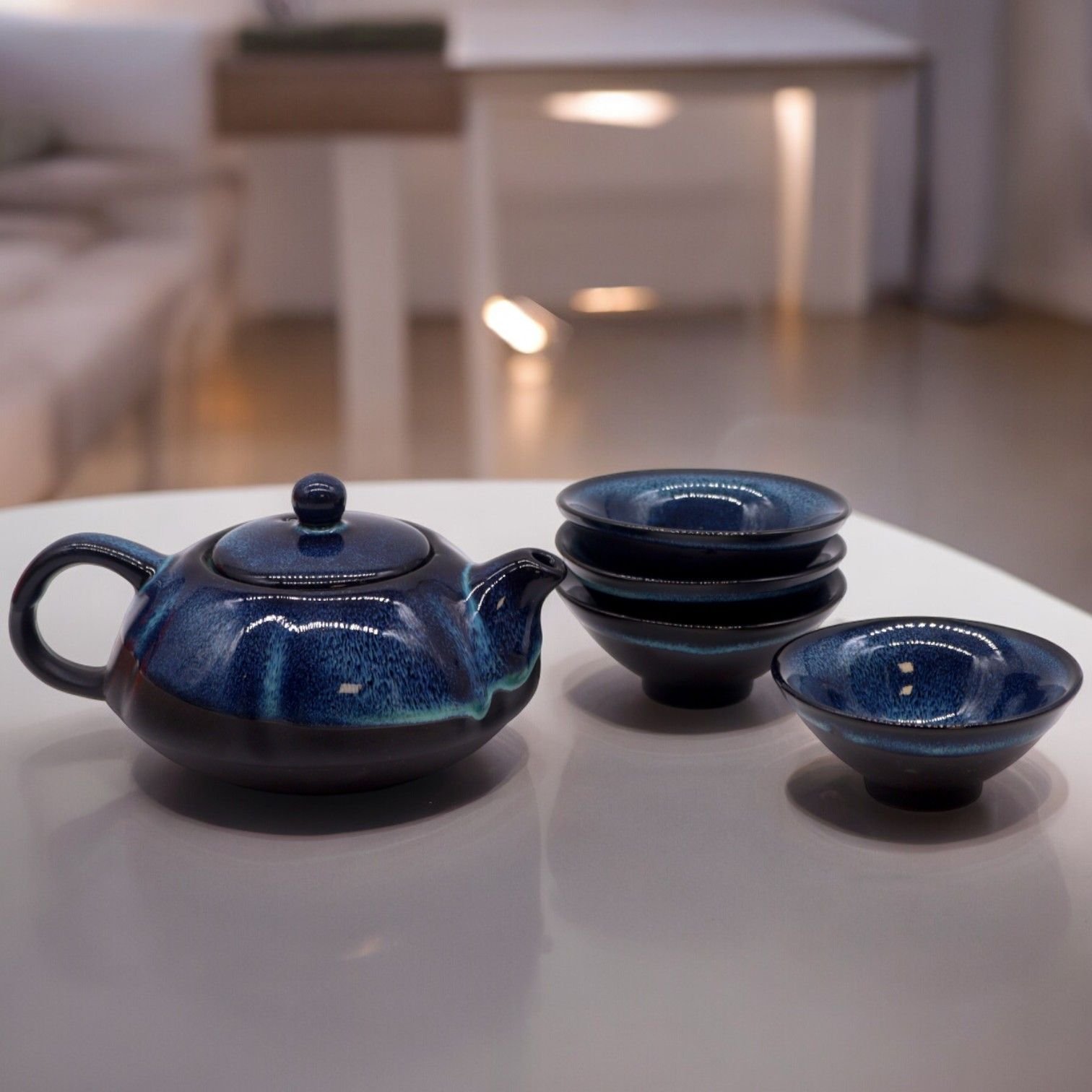 bG9jYWw6Ly9tZWRpYS85Ti9HRC82MFIzMEMxRzZXUzNHRDlOLzJhZmIxMmQ3LmpwZWc.jpg Ancient Wisdom Herbal Blues Glaze Ceramic Teapot & Four Cups Set - Image 1