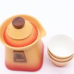 Ancient Wisdom Ceramic Temple Teapot & Three Cups Set – Orange Earth - Image 3