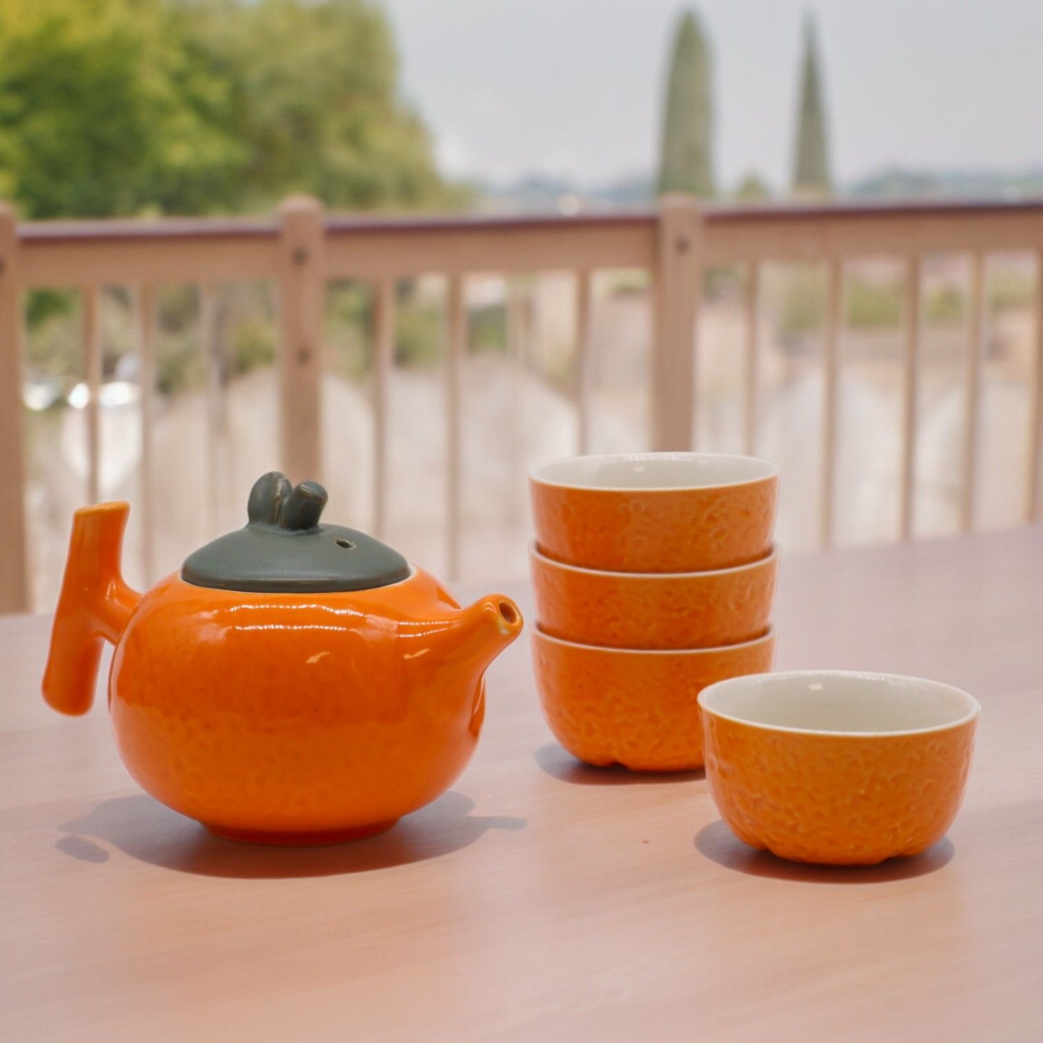 bG9jYWw6Ly9tZWRpYS8xUy9HRC82MFIzMEMxRzZXUzNHRDFTLzBlYWY0NmYzLmpwZWc.jpg Ancient Wisdom Herbal Orange Ceramic Teapot & Four Cups Set - Image 1