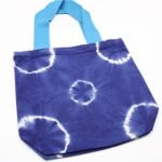 Ancient Wisdom Blue Rings Design Natural Tye-Dye Cotton Bag with Blue Handle - Image 3
