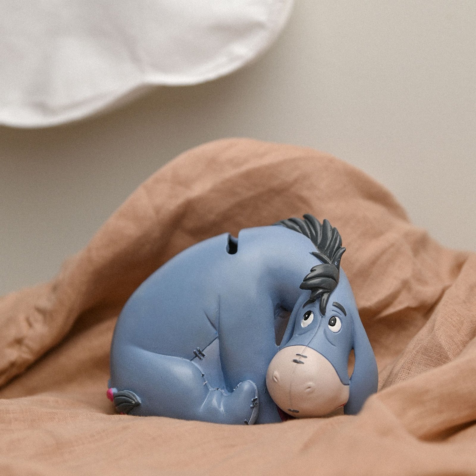 DI466_T01.jpg Disney: Magical Beginnings Resin Money Box - Eeyore - Image 1