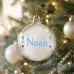 Personalised Blue Nutcracker Design White Feather Glass Christmas Bauble - Image 3