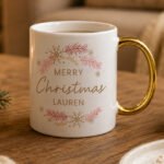 Personalised 'Merry Christmas' Pink & Gold Wreath Design Gold Handled Ceramic Mug